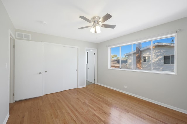 9002 N Clifton Ave, Niles, IL 60714 - unfurnished bedroom featuring baseboards, light wood-style flooring, a closet, and a ceiling fan