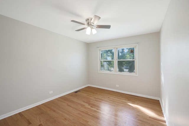 9002 N Clifton Ave, Niles, IL 60714 - spare room featuring baseboards, light wood-style floors, and a ceiling fan