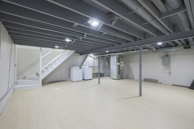 9002 N Clifton Ave, Niles, IL 60714 - finished basement with washer and clothes dryer, stairs, wood finished floors, heating unit, and electric panel