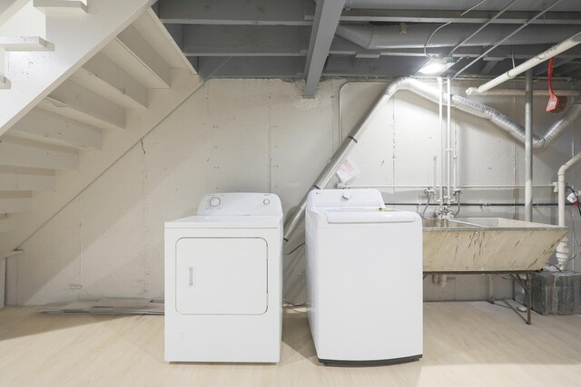 9002 N Clifton Ave, Niles, IL 60714 - washroom featuring independent washer and dryer and wood finished floors
