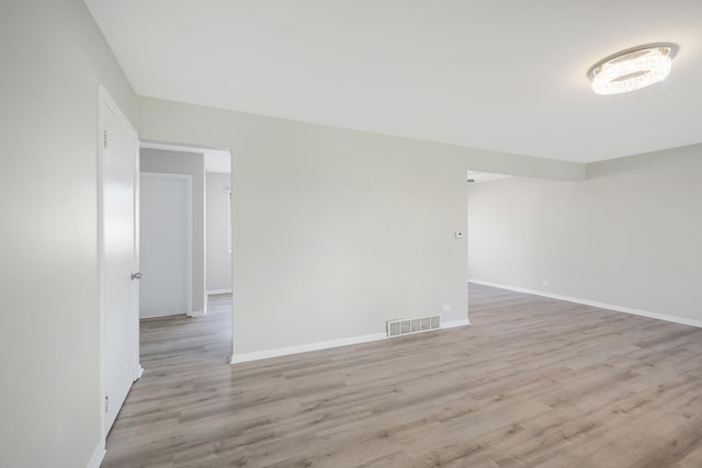 9002 N Clifton Ave, Niles, IL 60714 - spare room featuring light wood-type flooring and baseboards