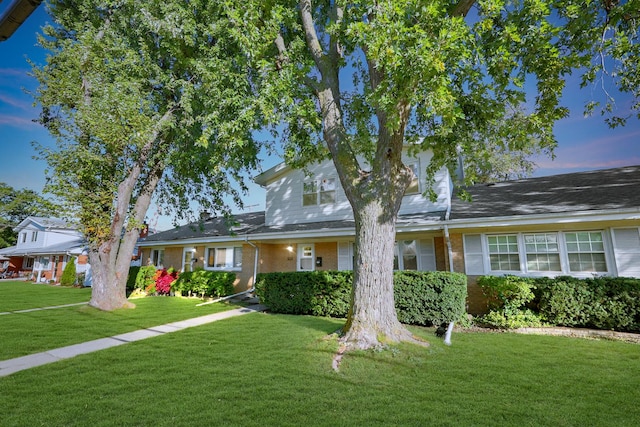 9002 N Clifton Ave, Niles, IL 60714 - view of front of house featuring a front yard and brick siding