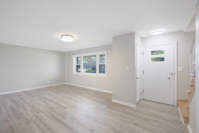 9002 N Clifton Ave, Niles, IL 60714 - entryway featuring light wood-style floors, baseboards, and stairs