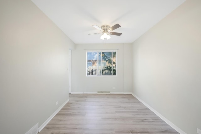 9002 N Clifton Ave, Niles, IL 60714 - unfurnished room with a ceiling fan, light wood finished floors, and baseboards