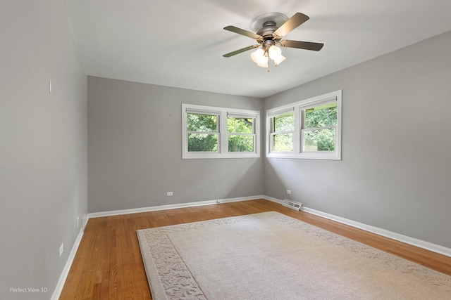 8540 W 119th St, Palos Park, IL 60464 - empty room featuring ceiling fan and wood finished floors
