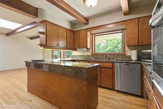 8540 W 119th St, Palos Park, IL 60464 - kitchen with stainless steel appliances, beam ceiling, brown cabinetry, light wood-style floors, and a peninsula