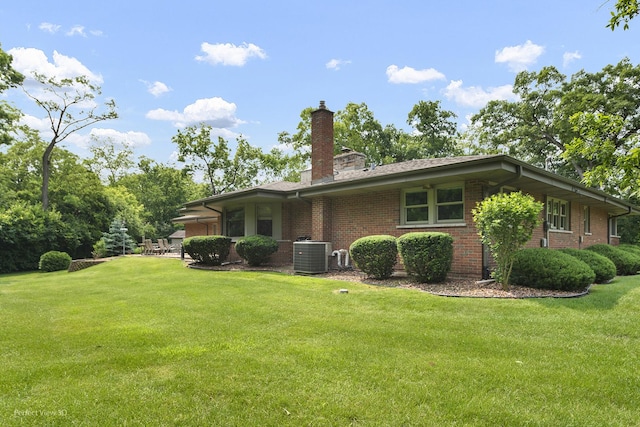 8540 W 119th St, Palos Park, IL 60464 - rear view of house with brick siding, a yard, and a chimney