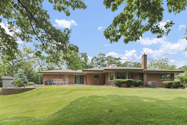 8540 W 119th St, Palos Park, IL 60464 - back of house with brick siding, a yard, and a chimney