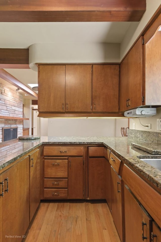 8540 W 119th St, Palos Park, IL 60464 - kitchen with light wood-style floors, beam ceiling, light stone countertops, and brown cabinets