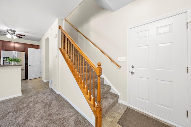 1133 Heron Cir, Joliet, IL 60431 - staircase with ceiling fan, carpet flooring, baseboards, and tile patterned flooring