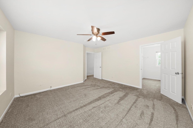 1133 Heron Cir, Joliet, IL 60431 - empty room with carpet flooring, ceiling fan, and baseboards