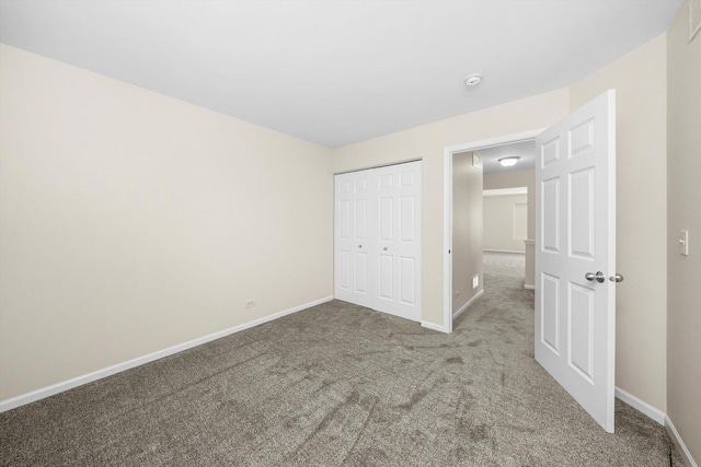1133 Heron Cir, Joliet, IL 60431 - unfurnished bedroom featuring carpet, baseboards, and a closet