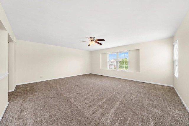 1133 Heron Cir, Joliet, IL 60431 - empty room with ceiling fan, carpet, and baseboards