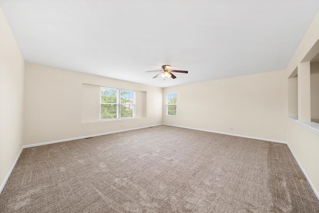 1133 Heron Cir, Joliet, IL 60431 - empty room featuring a ceiling fan, carpet floors, and baseboards