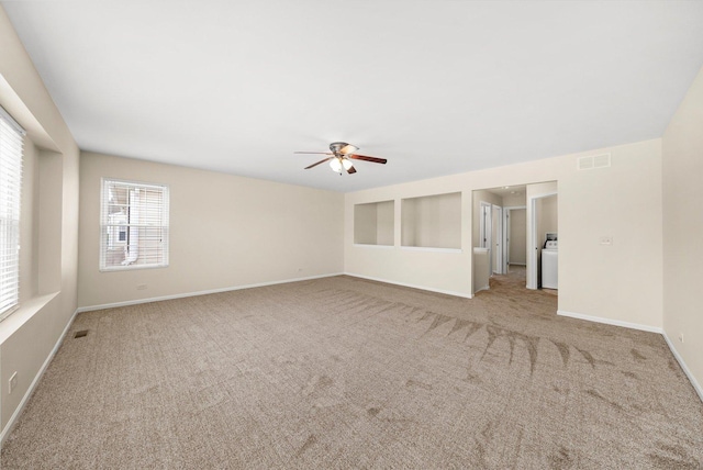 1133 Heron Cir, Joliet, IL 60431 - carpeted empty room with ceiling fan, baseboards, and washer / dryer