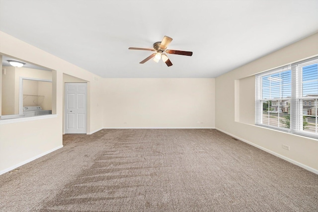 1133 Heron Cir, Joliet, IL 60431 - carpeted spare room featuring ceiling fan, washer and clothes dryer, and baseboards