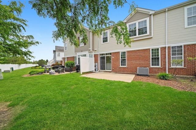 1133 Heron Cir, Joliet, IL 60431 - back of house featuring central AC, a patio area, and brick siding