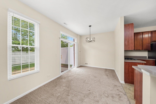 1133 Heron Cir, Joliet, IL 60431 - unfurnished dining area with light carpet and baseboards