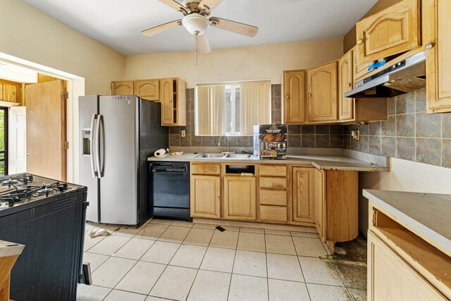 7637 S Ridgeland Ave, Chicago, IL 60649 - kitchen featuring black appliances, under cabinet range hood, a sink, and plenty of natural light