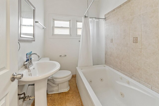 7637 S Ridgeland Ave, Chicago, IL 60649 - full bath with toilet, tile patterned floors, and a combined bath / shower with jetted tub