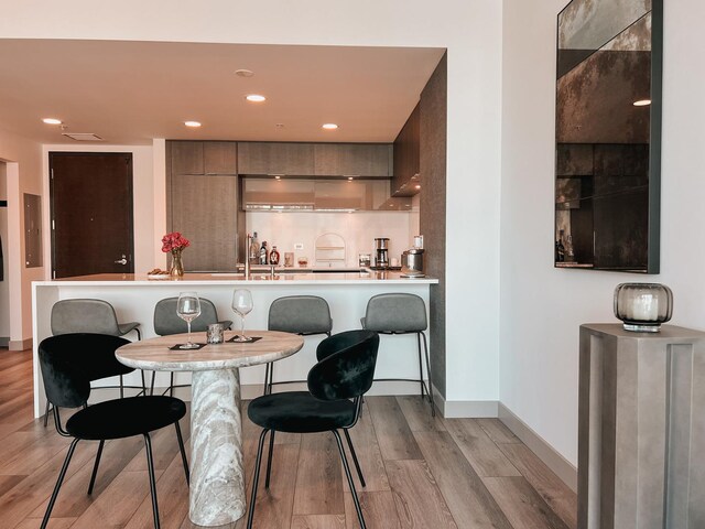 240 E Illinois St Unit 2206, Chicago, IL 60611 - dining room with light wood finished floors, baseboards, and recessed lighting