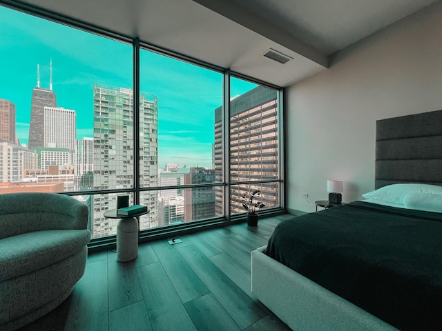 240 E Illinois St Unit 2206, Chicago, IL 60611 - bedroom with a city view, expansive windows, multiple windows, and wood finished floors