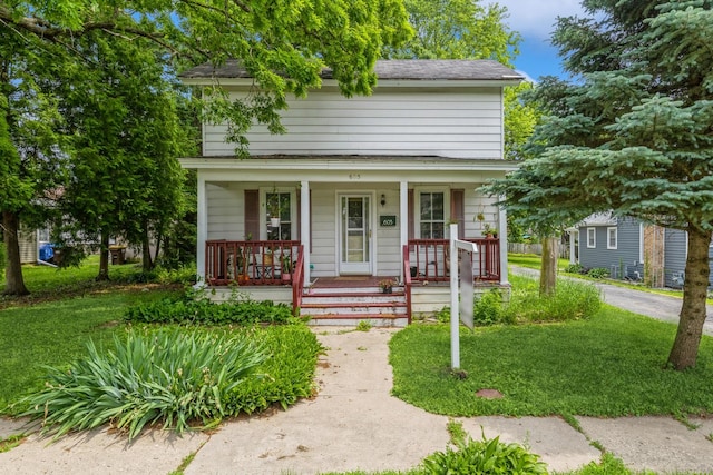 605 N Jefferson St, Harvard, IL 60033 - view of front facade with a porch and a shingled roof