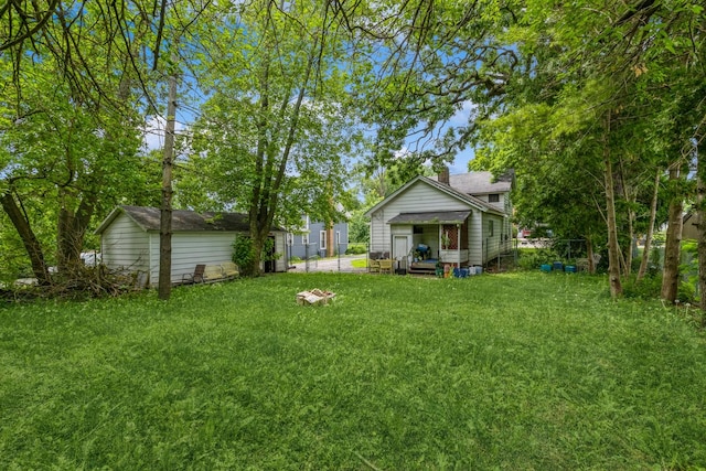 605 N Jefferson St, Harvard, IL 60033 - view of green lawn featuring an outbuilding