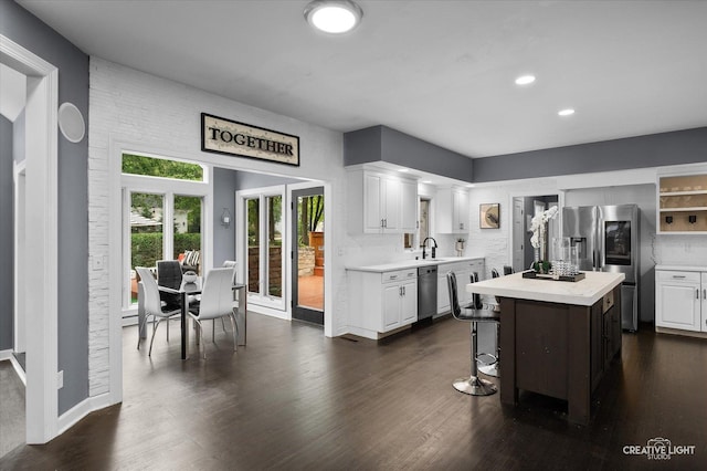 1033 Forest Trl, Sugar Grove, IL 60554 - kitchen with stainless steel appliances, light countertops, white cabinets, a kitchen island, and recessed lighting