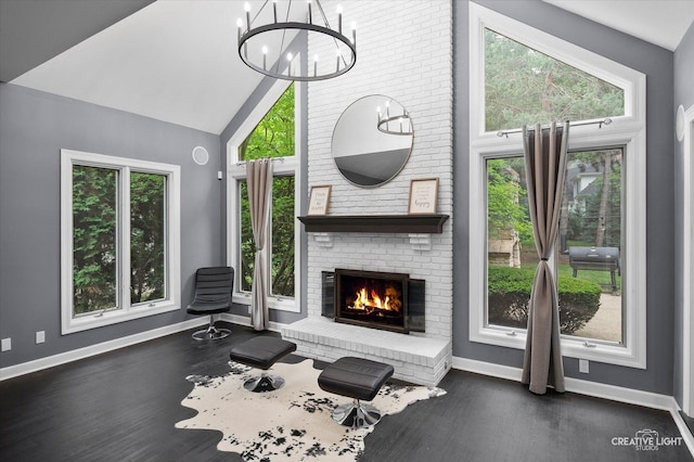 1033 Forest Trl, Sugar Grove, IL 60554 - living area with dark wood-style flooring, a chandelier, a fireplace, and high vaulted ceiling