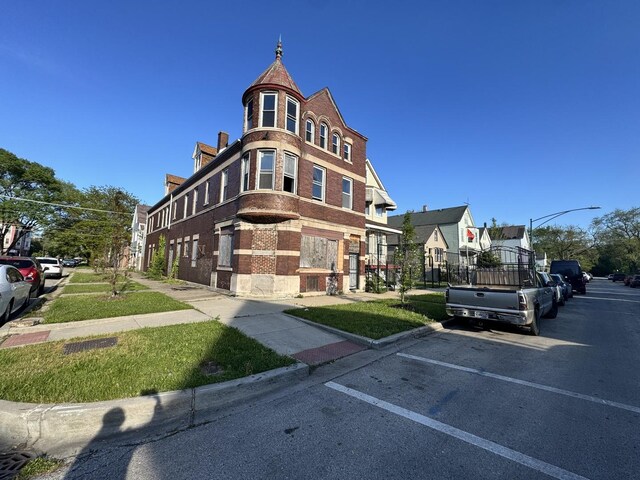 8401 S Brandon Ave, Chicago, IL 60617 - view of building exterior with uncovered parking