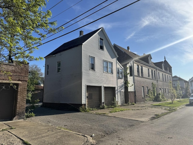 8401 S Brandon Ave, Chicago, IL 60617 - view of home's exterior featuring a residential view and an attached garage