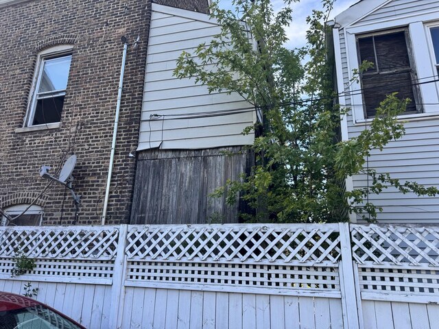 8401 S Brandon Ave, Chicago, IL 60617 - view of home's exterior with a chimney