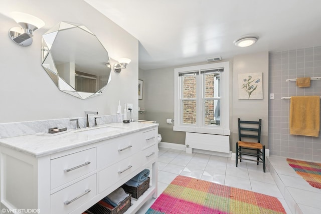 2558 W Cullom Ave, Chicago, IL 60618 - bathroom featuring vanity and tile patterned floors