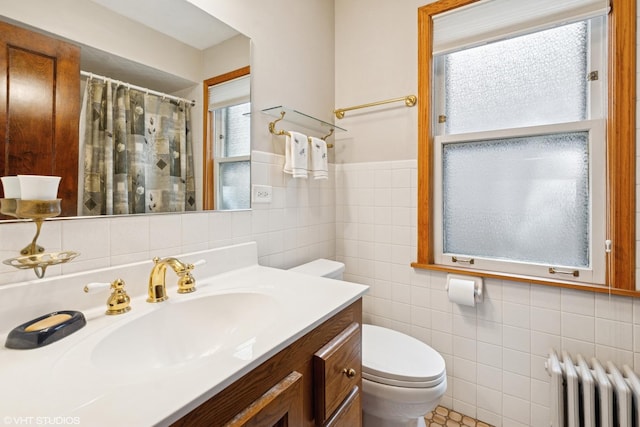 2558 W Cullom Ave, Chicago, IL 60618 - bathroom with radiator, tile walls, vanity, and a shower with curtain