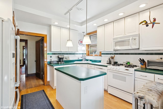 2558 W Cullom Ave, Chicago, IL 60618 - kitchen with white appliances, white cabinets, light wood finished floors, decorative backsplash, and dark countertops