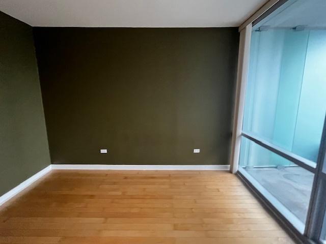8 E Randolph St Unit 3206, Chicago, IL 60601 - spare room with light wood finished floors and baseboards