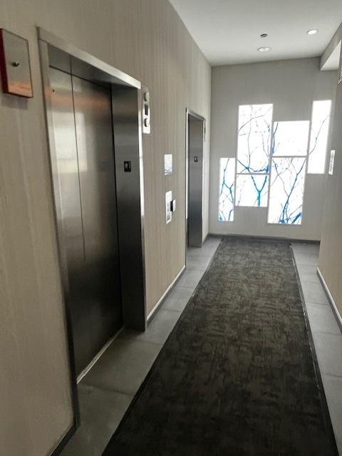 8 E Randolph St Unit 3206, Chicago, IL 60601 - hall featuring elevator and light tile patterned floors