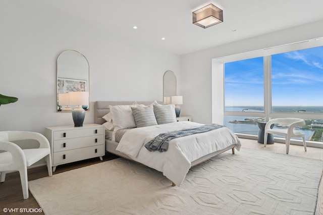 363 E Wacker Dr Unit 6301, Chicago, IL 60601 - bedroom with a water view, wood finished floors, and recessed lighting
