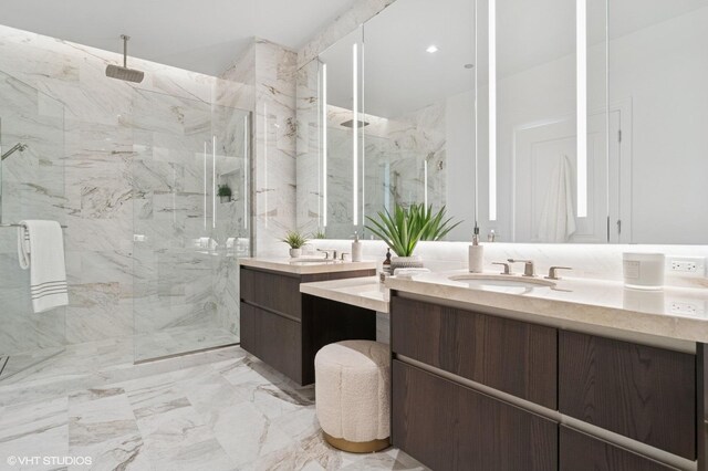 363 E Wacker Dr Unit 6301, Chicago, IL 60601 - bathroom featuring a marble finish shower, vanity, and marble tiled floors