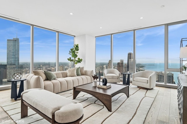 363 E Wacker Dr Unit 6301, Chicago, IL 60601 - living room with a wall of windows, wood finished floors, plenty of natural light, a city view, and a water view