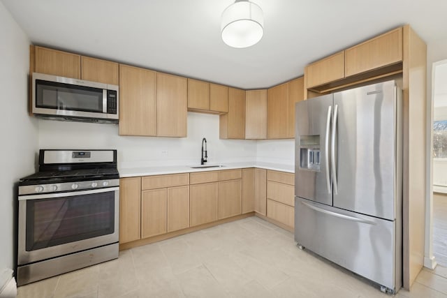 2 Le Moyne Pkwy Unit 3N, Oak Park, IL 60302 - kitchen with appliances with stainless steel finishes, a sink, light brown cabinets, light countertops, and light tile patterned flooring