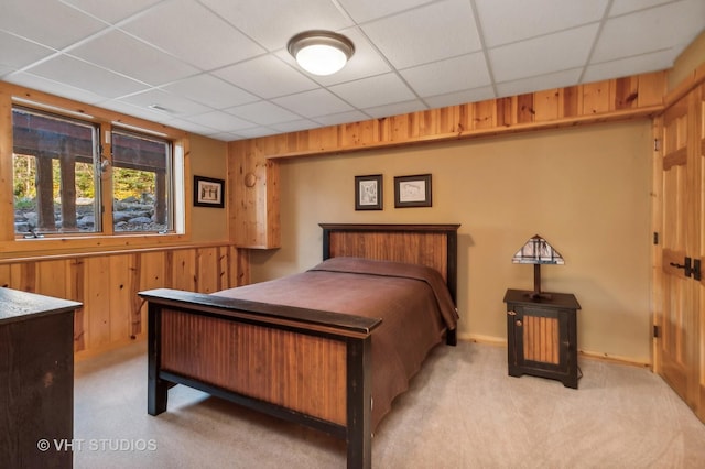 2317 Paulson Rd, Harvard, IL 60033 - bedroom featuring light colored carpet, wood walls, and a drop ceiling