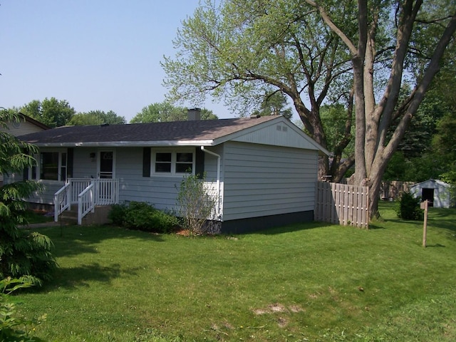 1711 Beach Rd, Mchenry, IL 60050 - rear view of house with a chimney