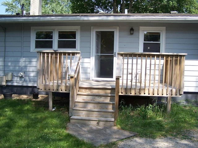 1711 Beach Rd, Mchenry, IL 60050 - doorway to property featuring a chimney and a wooden deck