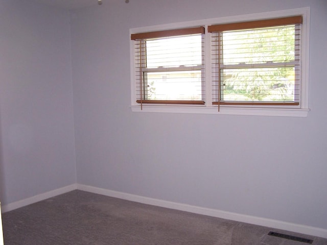 1711 Beach Rd, Mchenry, IL 60050 - carpeted empty room featuring baseboards