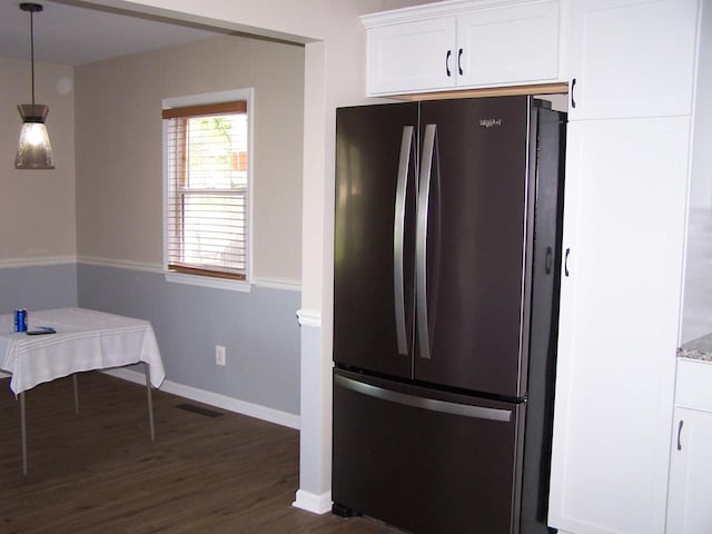 1711 Beach Rd, Mchenry, IL 60050 - kitchen with freestanding refrigerator, dark wood finished floors, white cabinets, and hanging light fixtures