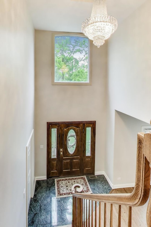 19 S Home Ave, Park Ridge, IL 60068 - entrance foyer with a chandelier, a towering ceiling, and baseboards