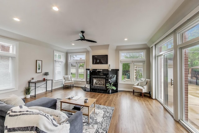 19 S Home Ave, Park Ridge, IL 60068 - living area with a tile fireplace, wood finished floors, ceiling fan, recessed lighting, and baseboards