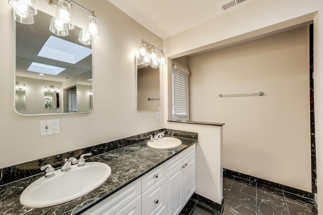 19 S Home Ave, Park Ridge, IL 60068 - bathroom featuring double vanity, marble finish flooring, and baseboards